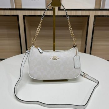 First-quality Coach Teri Sling Shoulder Bag made of premium leather with adjustable strap and elegant gold-tone accents, perfect for everyday use