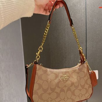 First-quality Coach Teri Sling Shoulder Bag made of premium leather with adjustable strap and elegant gold-tone accents, perfect for everyday use