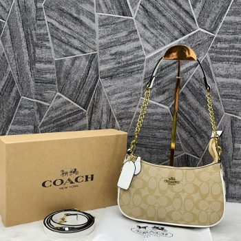 First-quality Coach Teri Sling Shoulder Bag made of premium leather with adjustable strap and elegant gold-tone accents, perfect for everyday use