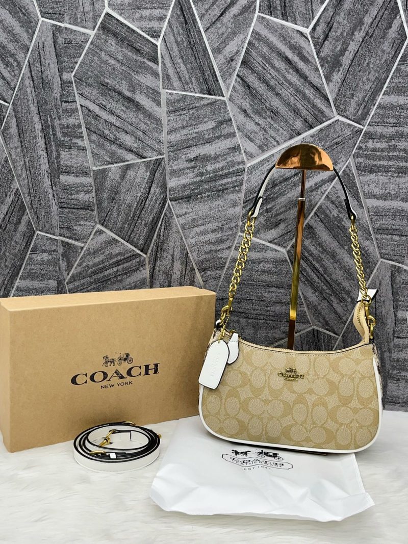 First-quality Coach Teri Sling Shoulder Bag made of premium leather with adjustable strap and elegant gold-tone accents, perfect for everyday use